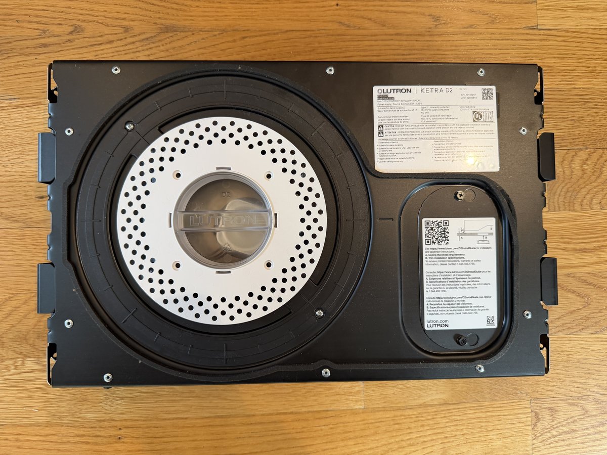 Ketra D2 white mud-in plate installed flush against the drywall surface, ready to plaster